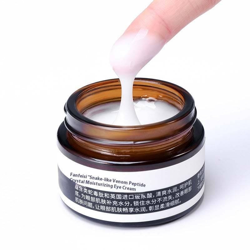Top Rated Best Firming Eye Cream with Retinol being applied with a finger, highlighting its smooth, hydrating consistency for firming tired eyes.