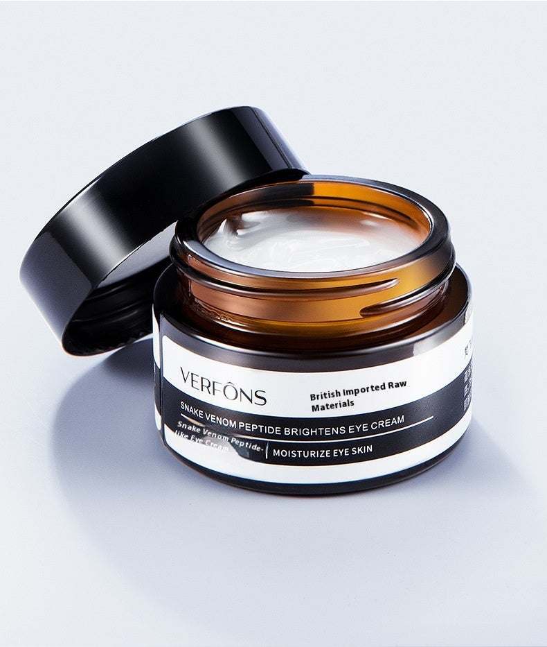 Top Rated Best Firming Eye Cream with Retinol in an open jar, showcasing its rich formula for lifting and moisturizing delicate eye skin.